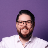 Friedrich Jeschke Portraitbild eines bärtigen Mannes mit Brille.