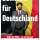 Ein Plakat von Die PARTEI. Direktkandidat Benkhoff steht vor einer belgischen Flagge. Auf dem Plakat steht „Benkhoff für Deutschland“.